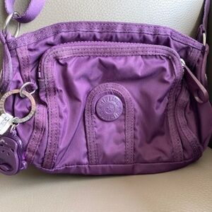 KIPLING small crossbody purse purple with plastic monkey charm